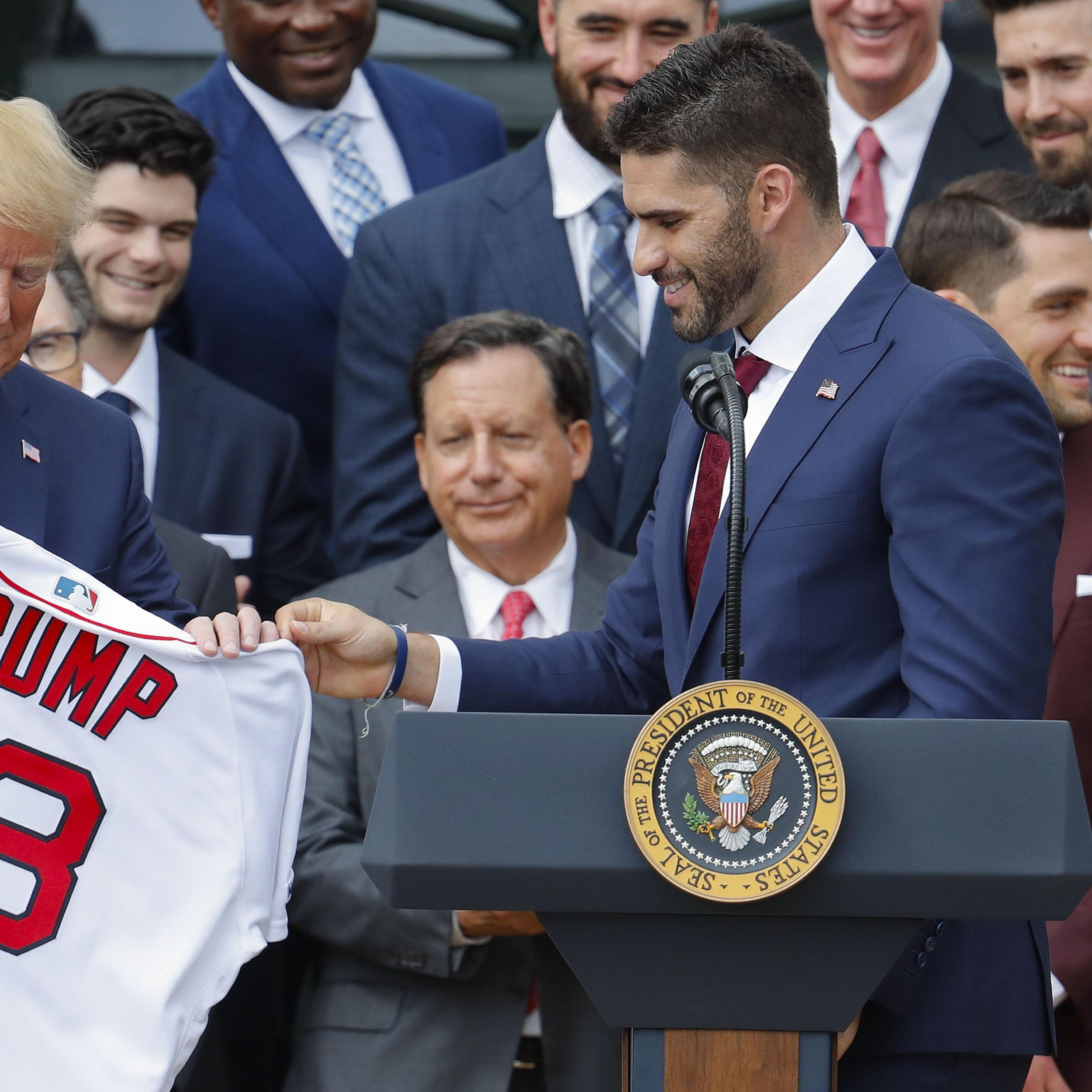 President Donald Trump shakes hands with Boston Red Sox outfielder J. D.  Martinez as he welcomes the 2018 World Series Champions Boston Red Sox,  during a ceremony honoring them at the White