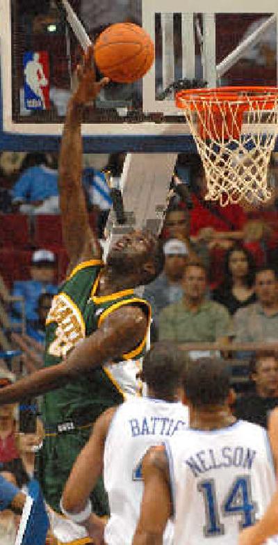 
SuperSonics center Johan Petro shoots during the first half. 
 (Associated Press / The Spokesman-Review)