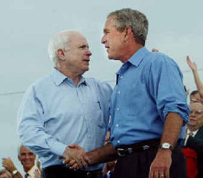
Sen. John McCain, R-Ariz. shakes hands with President Bush during a campaign rally at Panama City Marina Tuesday in Panama City, Fla. 
 (Associated Press / The Spokesman-Review)
