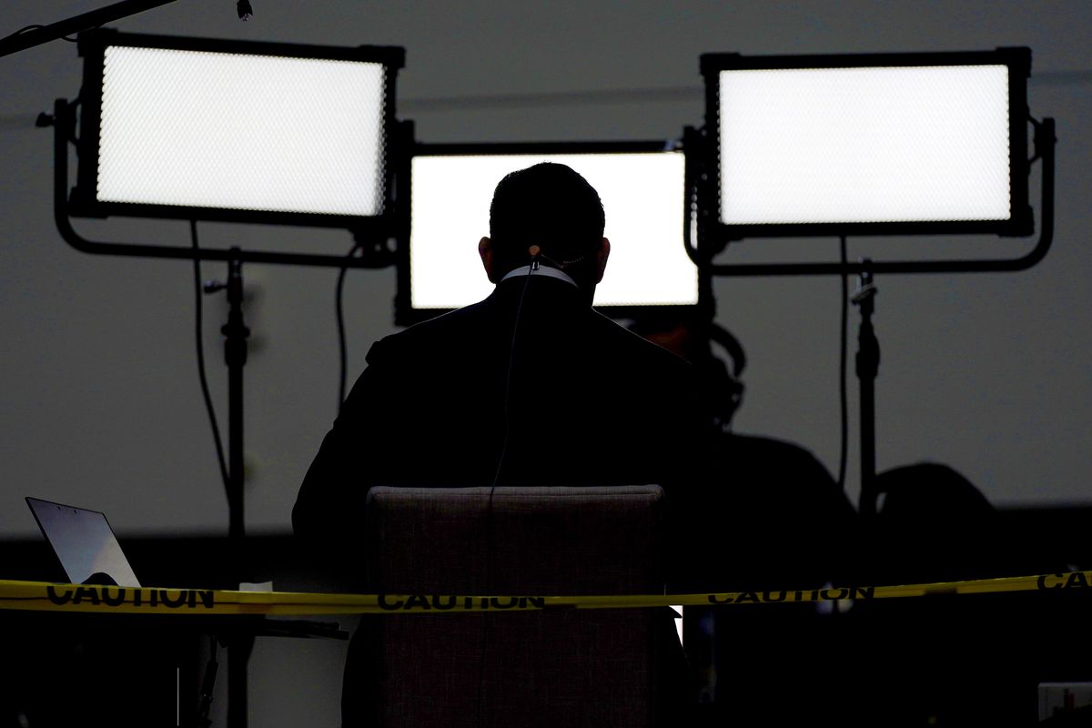 FILE - In this Sept. 29, 2020, file photo a broadcast journalist sits in front of lights ahead of the first presidential debate between Republican candidate President Donald Trump and Democratic candidate former Vice President Joe Biden at the Health Education Campus of Case Western Reserve University in Cleveland. A new study of people