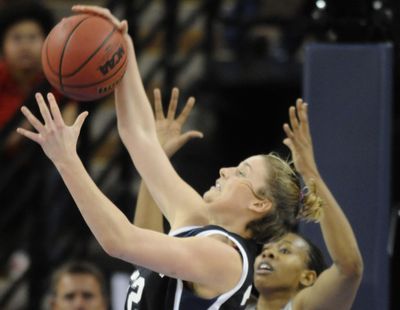 Gonzaga's Kayla Standish  grabs a rebound over Xavier's April Phillips in  the first half at Sacramento's Arco Arena on Saturday, March 27, 2010. (Colin Mulvany / The Spokesman-Review)