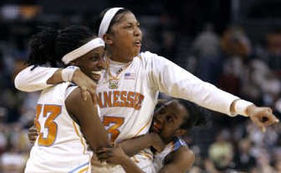 
Tennessee's Alberta Auguste, left, Candace Parker, center, and Shannon Bobbitt celebrate 47-46 Final Four win over LSU. Associated Press
 (Associated Press / The Spokesman-Review)