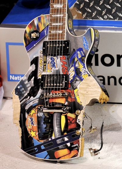 Kyle Busch smashed this hand-painted Les Paul guitar in victory lane last Saturday.  (Associated Press / The Spokesman-Review)