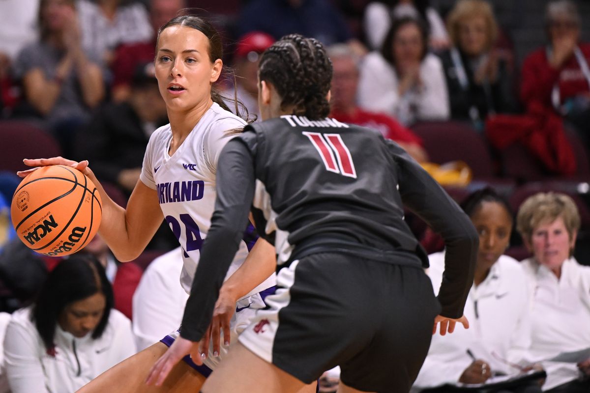 Portland guard Maisie Burnham, a Liberty High grad, drives the ball against WSU guard Astera Tuhina during a WCC tournament semifinal Monday at Orleans Arena in Las Vegas.  (Tyler Tjomsland/The Spokesman-Review)