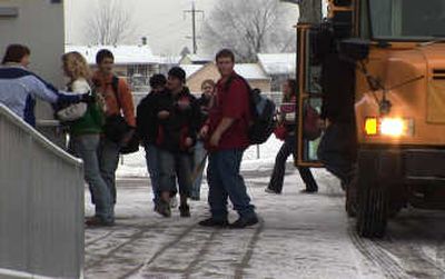 
East Valley School District students disembark at Trent Elementary on Friday, after the district closed all its schools. 
 (Colin Mulvany / The Spokesman-Review)