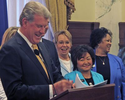 Idaho Gov. Butch Otter signs the law intended to boost teacher pay over the next five years Thursday in Boise. (Associated Press)