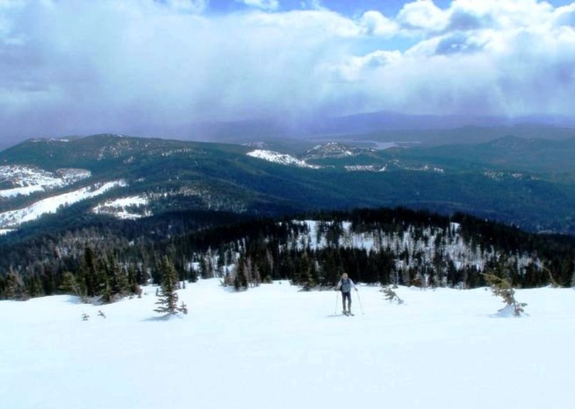 Lone skier skinning up the upper icy slopes of Mount Spokane Sunday 4-17-11. Newman Lake in the background. (Steve Reynolds)
