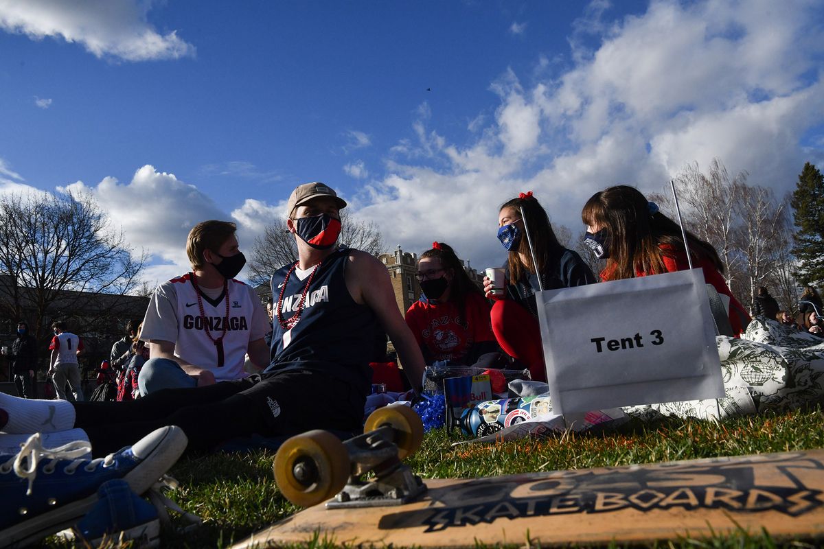 Gonzaga students, from left: Kevin Fagan, Martin Geiger, Mikayla McCubbin, Olivia La Terra and Olivia Molitor wait for tipoff during Tent City: The Remix, a socially distant Kennel Club watch party of Gonzaga