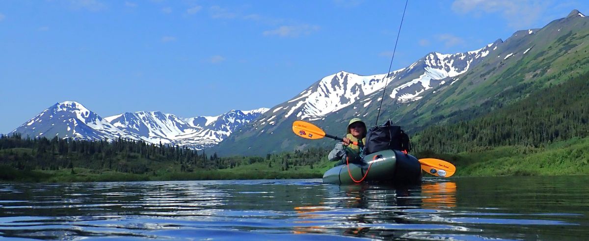 A packraft carries Scott Wolff and his camping and fishing gear through a remote lake and river system in northern British Columbia.  (RICH LANDERS/FOR THE SPOKESMAN-REVIEW)