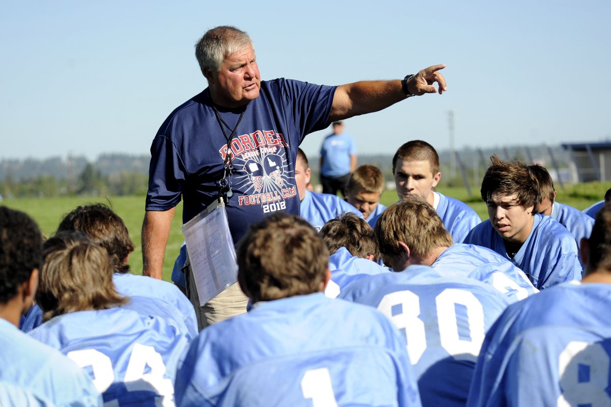 Coach Rick Giampietri outlines the practice for his players at Central Valley High School on Thursday. (Jesse Tinsley)