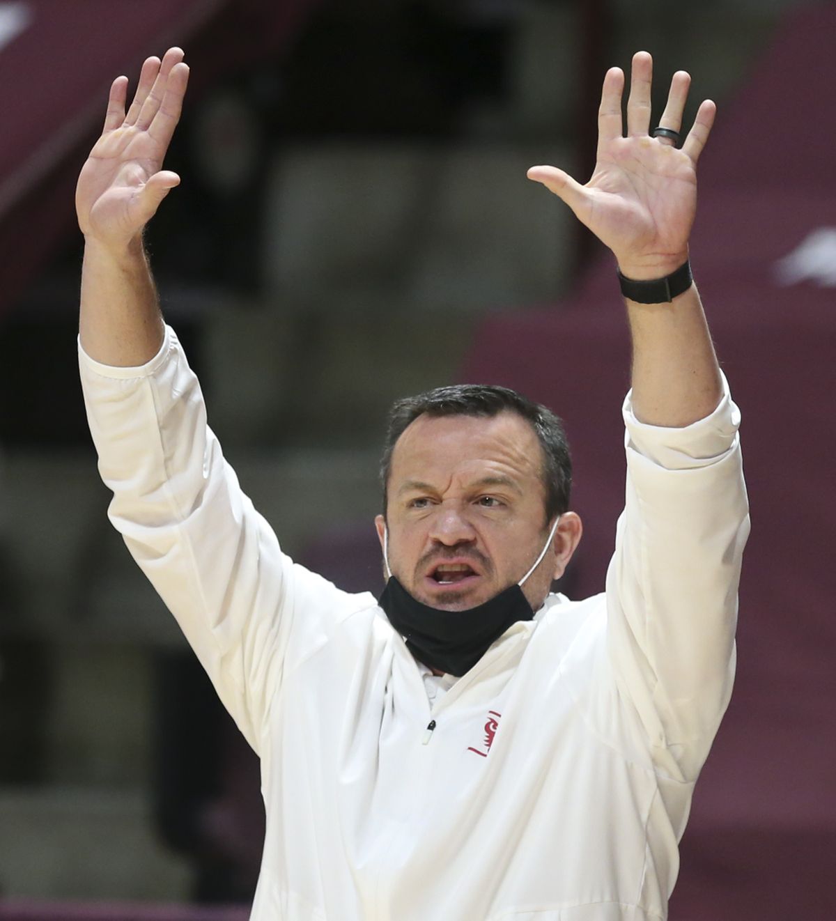 Louisville coach Jeff Walz gestures during the first half of the team