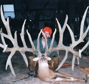 Is this deer hunting photo of a world record whitetail buck a hoax?  We think so. (Anonymous)
