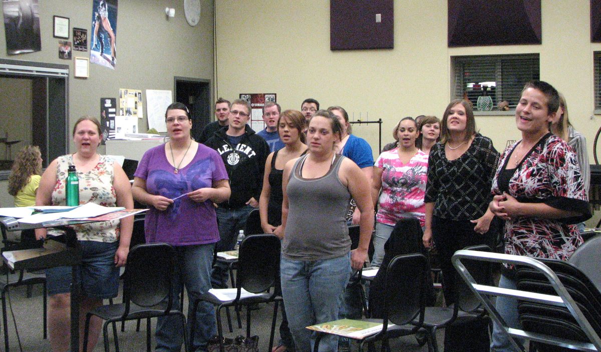 A group of former Rogers High School students rehearse Sept. 16 for the choir reunion concert. (Pia Hallenberg)