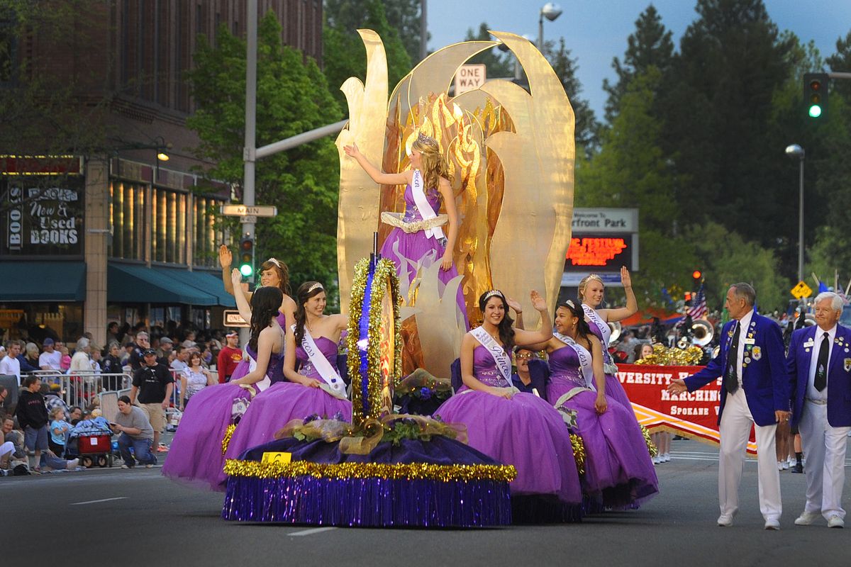 Lilac Festival Queen MacKenzie Johnson and her court make their way through downtown Spokane as a huge crowd watches the parade Saturday. (Christopher Anderson)