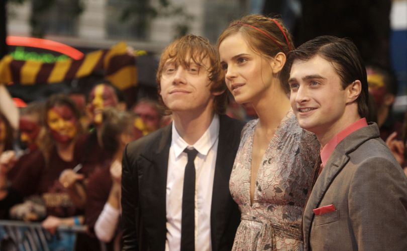 ORG XMIT: LENT105 British actors Daniel Radcliffe, right, Emma Watson, centre and Rupert Grint arrive for the World Premiere of Harry Potter and the Half-Blood Prince, at a cinema in Leicester Square, central London, Tuesday, July 7 2009. (AP Photo/Joel Ryan) (Joel Ryan / The Spokesman-Review)