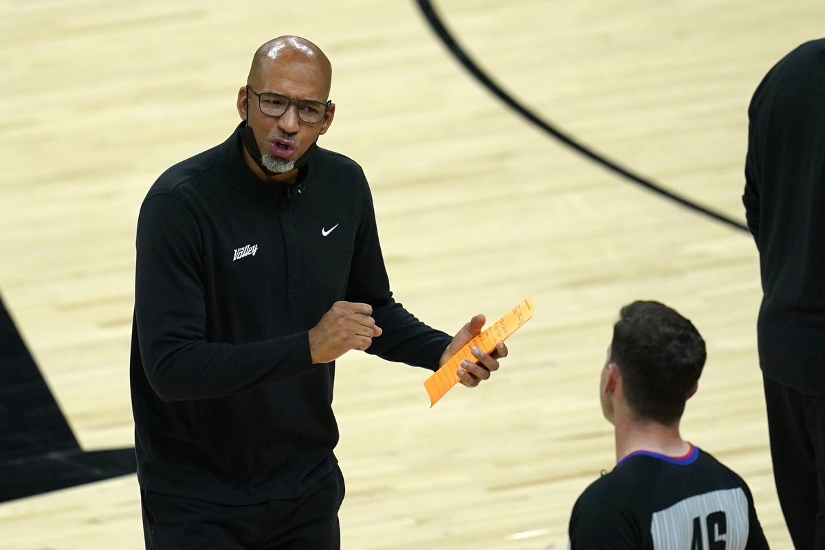 Phoenix Suns head coach Monty Williams, left, argues with referee Ben Taylor (46) during the first half of Game 1 of the NBA basketball Western Conference finals against the Los Angeles Clippers, Sunday, June 20, 2021, in Phoenix.  (Ross D. Franklin)