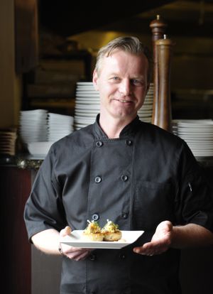Urs Moser, the executive chef at the Spokane Club, shows off a plate of crab cakes. Moser will lend his talents for cooking and wine pairing at the annual Hospice of Spokane fundraiser. Look for this story in Wednesday’s Food section. (Jesse Tinsley)