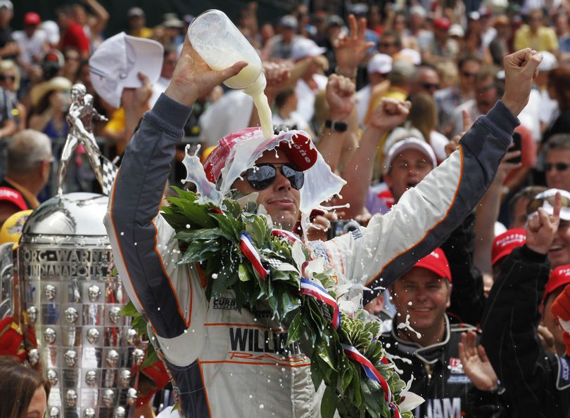 Dan Wheldon continues the tradition of the winner dousing himself with milk after a thrilling Indianapolis 500 victory Sunday. (Associated Press)