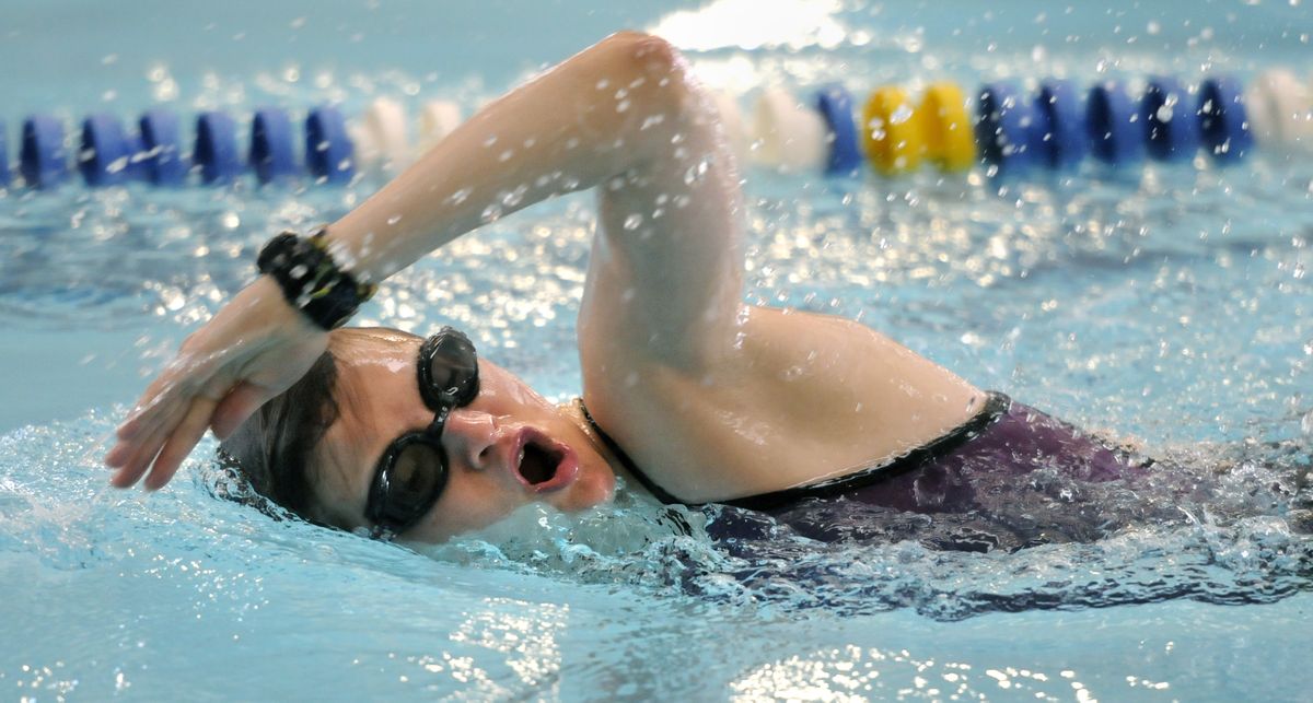 Senior Andrea Nelson works out in the YMCA pool in north Spokane to keep in shape while her lower leg heals.  (Dan Pelle)