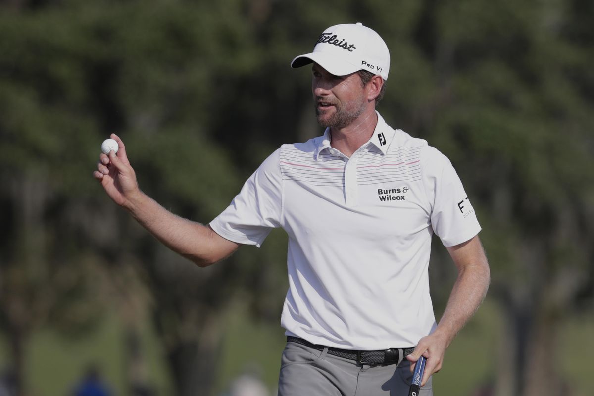 Webb Simpson holds up his ball on the 18th green during the second round of The Players Championship golf tournament Friday, May 11, 2018, in Ponte Vedra Beach, Fla. (Lynne Sladky / Associated Press)