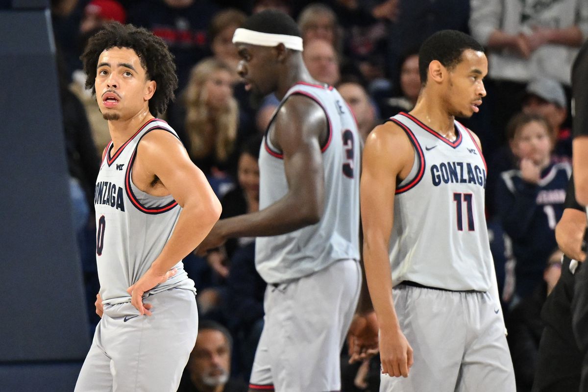 Gonzaga players, from left, Ryan Nembhard, Graham Ike and Nolan Hickman react late in the second half on Dec. 29 during an 84-74 home loss to San Diego State.  (Tyler Tjomsland/The Spokesman-Review)