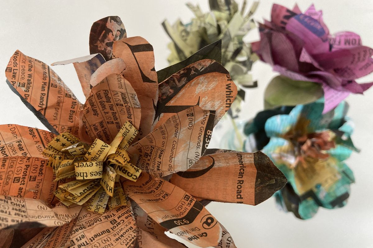 Yesterday’s news gets a colorful upgrade with these paper flowers.  (Katie Patterson Larson/For The Spokesman-Review)
