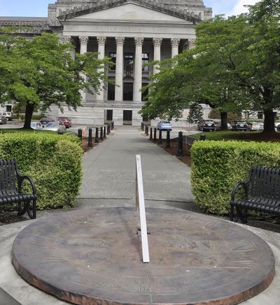 OLYMPIA -- The sundial in the walkway between the House and Senate office buildings, south of the domed Legislative Building, features scenes from state history and the proverb 