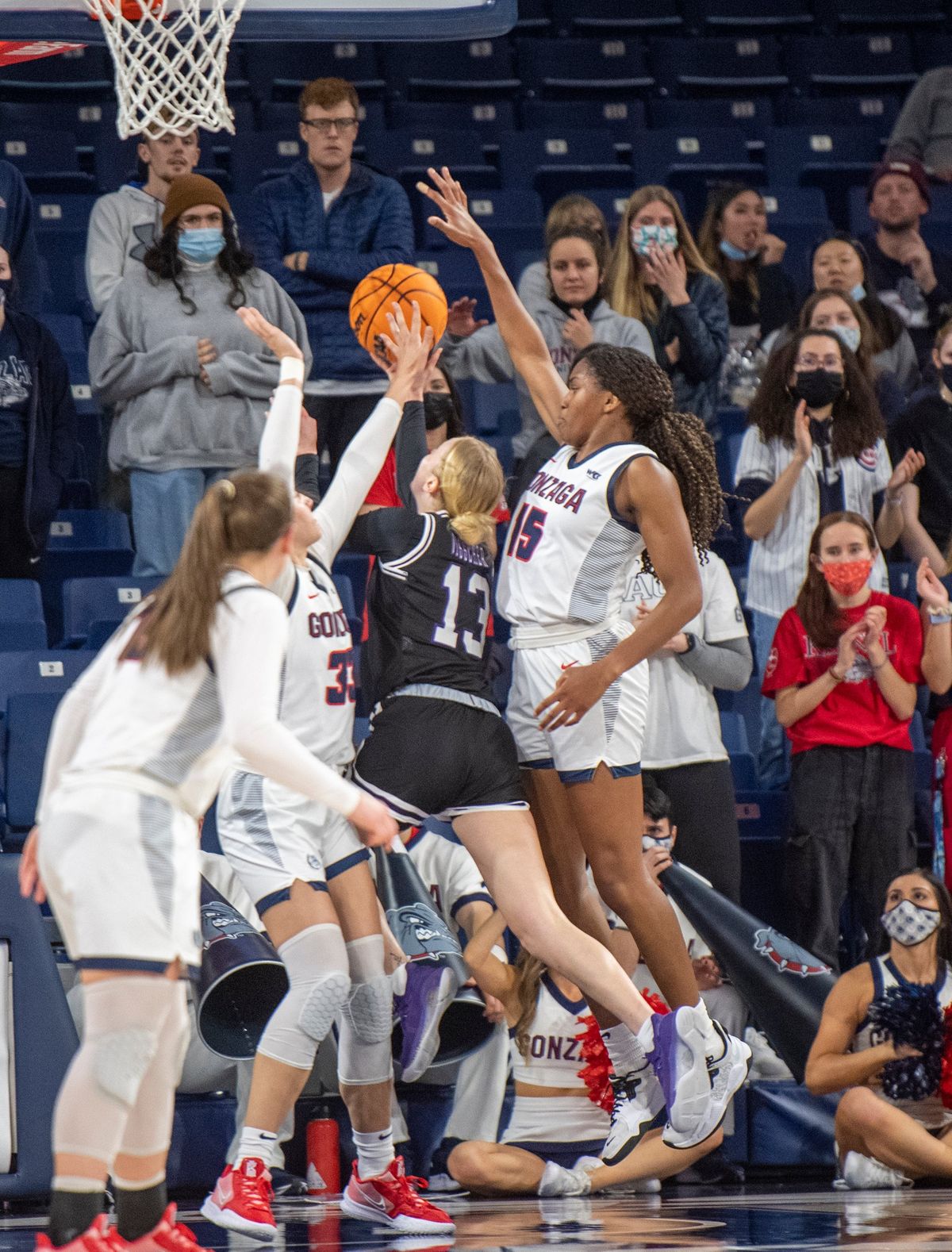 Gonzaga’s Melody Kempton, left, and Yvonne Ejim team up to deny Stephan F. Austin’s Stephanie Visscher a lay-in in their nonconference matchup last Sunday.  (JESSE TINSLEY)