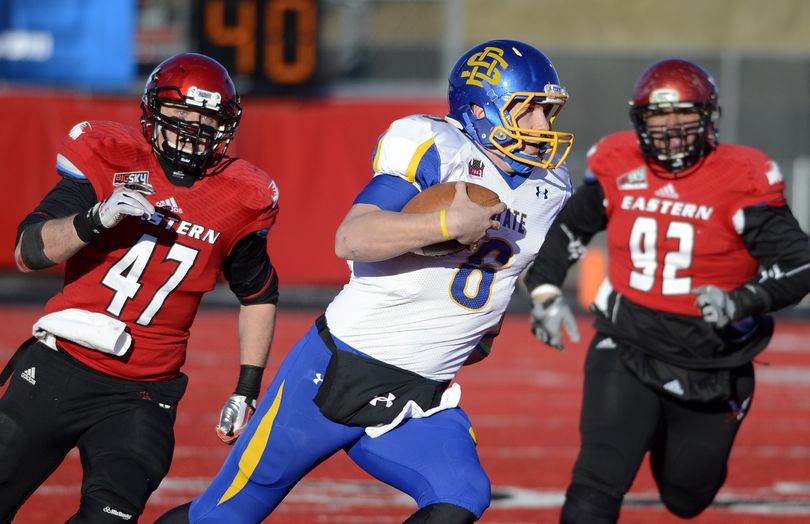 South Dakota State Jackrabbits quarterback Austin Sumner (6) runs the ball during the first half of a FCS second round playoffs college football game, Saturday, Dec. 7, 2013, at Roos Field in Cheney, Wash. (Colin Mulvany / The Spokesman-Review)