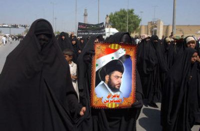 
Iraqi women, followers of radical Shiite cleric Muqtada al-Sadr rally in the holy Shiite city of Najaf, Iraq, Friday. Al-Sadr followers demonstrated across central and southern Iraq against proposals to establish a federal state. 
 (Associated Press / The Spokesman-Review)