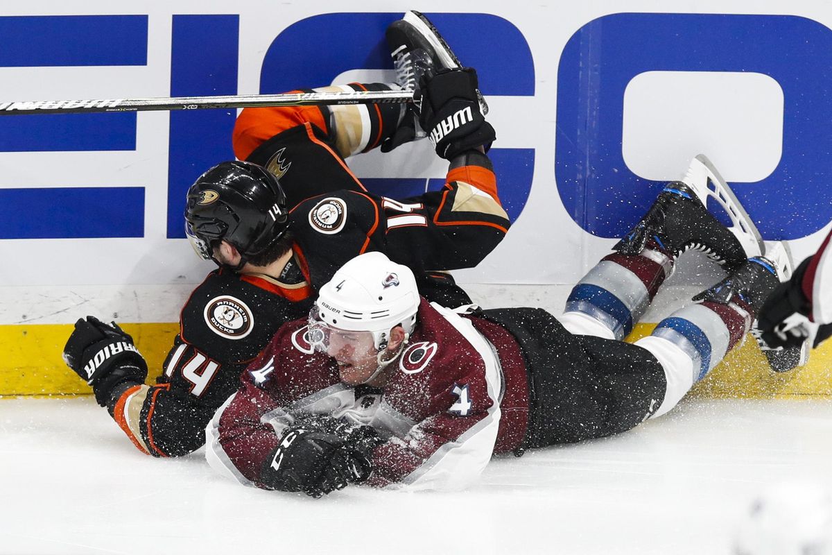 Anaheim Ducks’ Adam Henrique, left, and Colorado Avalanche’s Tyson Barrie tumble to the ice during the third period of an NHL hockey game Sunday, April 1, 2018, in Anaheim, Calif. The Ducks won 4-3 in overtime. (Jae C. Hong / Associated Press)