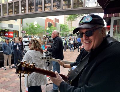 Peter Rivera, center, and Doug Clark perform on Main Avenue during Street Music Week, June 16, 2016, in downtown Spokane, Wash. (Dan Pelle / The Spokesman-Review)
