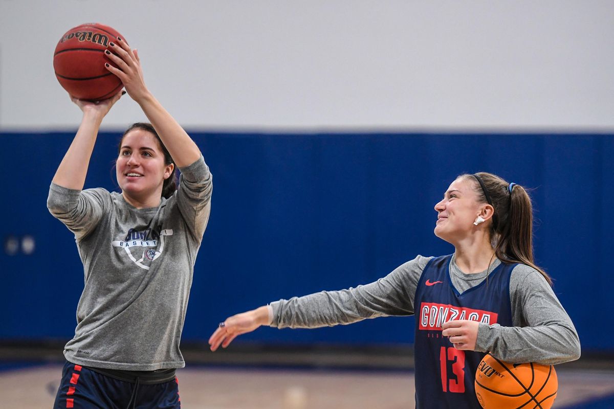 Gonzaga University seniors Melody Kempton, left, and Cierra Walker, chat before practice, Friday, Oct. 1, 2021 in the Volkar Center on campus. Kempton was the lone Bulldog to be voted to the 10-player West Coast Conference preseason team.  (DAN PELLE/THE SPOKESMAN-REVIEW)