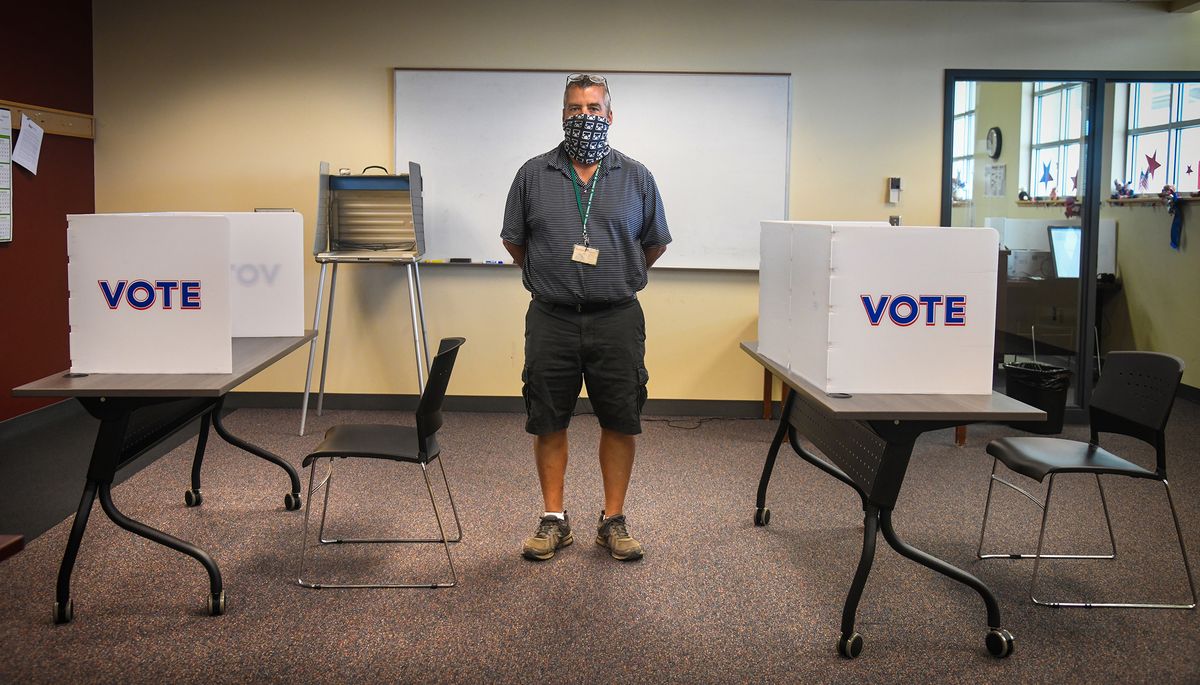 Elections Manager Mike McLaughlin stands in the conference/training room that has been converted into a distancing voting site with standing and sitting voting booths on Tuesday in Spokane.  (DAN PELLE/THE SPOKESMAN-REVIEW)