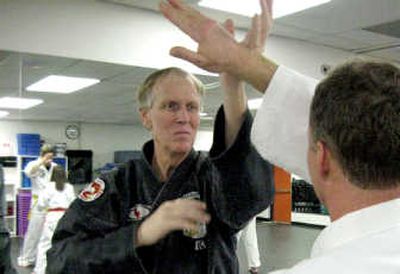 
American Kenpo instructor Dale Eberwein runs through a line-entry drill with a student during an evening class at North Idaho College.
 (Photo by Noah Buntain / The Spokesman-Review)