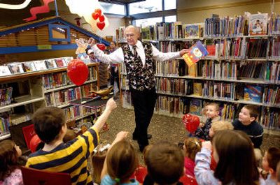 
Dick Frost stirs up the imagination of Moran Prairie kids while putting on a magic show Saturday morning at the new Moran Prairie library on Regal near 57th. The library includes a large children's area that has ample room for reading and  playing. 
 (Amanda Smith / The Spokesman-Review)