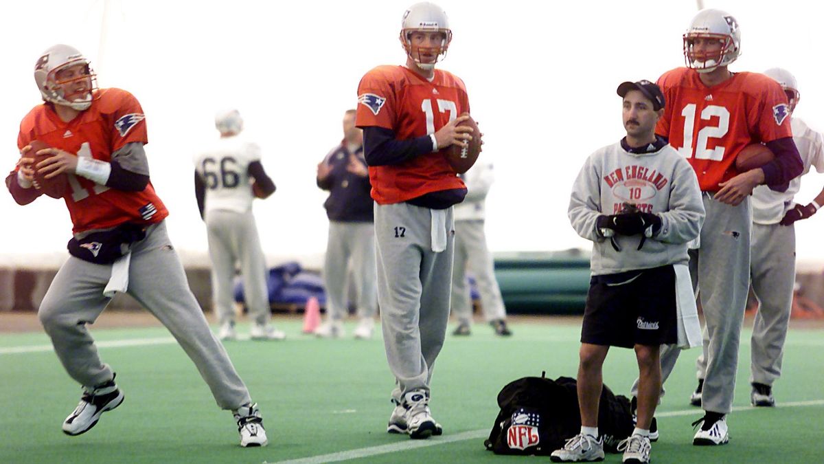 Former New England quarterbacks Drew Blesoe, left, John Friesz and Tom Brady take turns in a drill during a December 2000 practice in Foxborough, Mass.  (Bill Greene/Boston Globe )