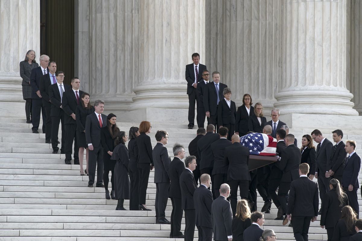 The casket of Sandra Day O'Connor arrives at the Supreme Court on Monday.    (Bonnie Jo Mount/The Washington Post)
