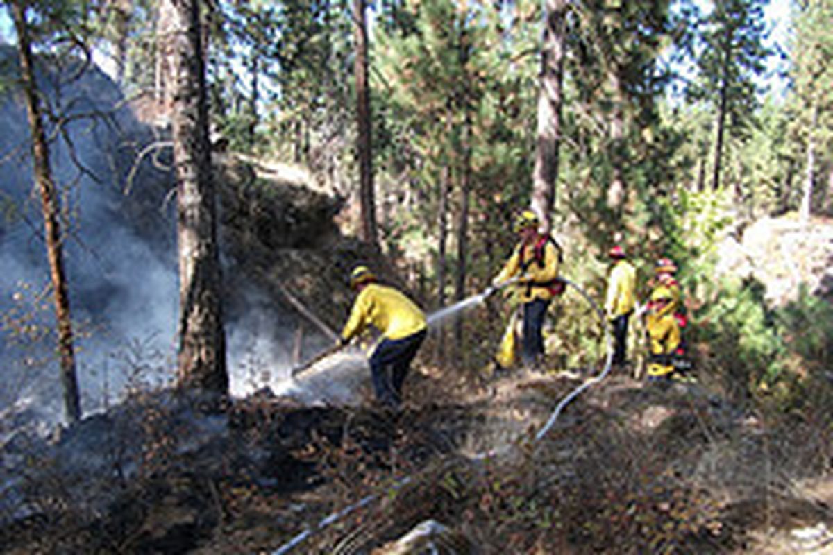 Spokane Valley Fire Department crews fight a brush fire in the Mirabeau Park natural area in Spokane Valley on Sept. 20, 2011.  (Photo courtesy the Spokane Valley Fire Department)