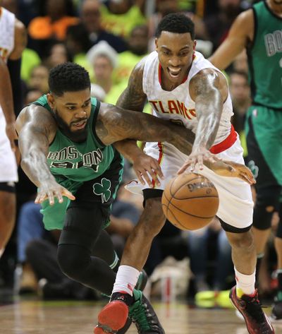 The Indiana Pacers acquired Jeff Teague, right, from the Atlantic Hawks in a point guard swap. (Curtis Compton / Associated Press)