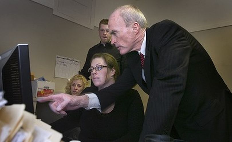 Spokane Mayor Dennis Hession checks election night returns at his campaign headquarters Tuesday November 6, 2007 as his daughter Sarah pulls up the results on the computer.At back left is his wife Jane. CHRISTOPHER ANDERSON The Spokesman-Review (Christopher Anderson / The Spokesman-Review)