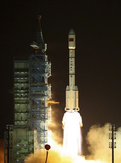 The Long March-2FT1 carrier rocket loaded with Tiangong-1 unmanned space lab module blasts off from the launch pad at the Jiuquan Satellite Launch Center in northwest China's Gansu Province, on the edge of the Gobi Desert, Thursday, Sept. 29, 2011. (Associated Press)