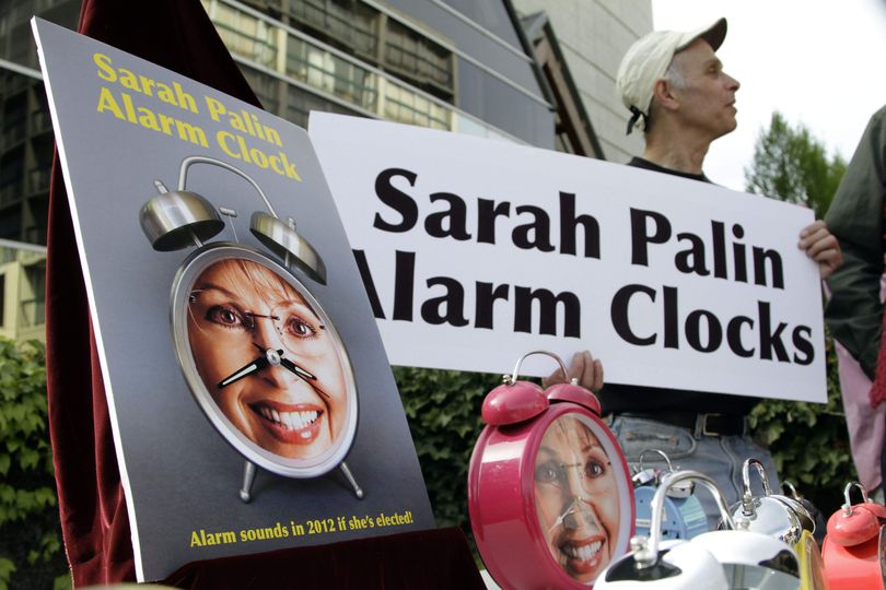 Protestor Paul Bodin, from Eugene, Ore.,  displays Sarah Palin alarm clocks outside the hotel where Sarah Palin, former vice presidential candidate and Alaskan governor, is scheduled to speak to a gathering of Lane County Republicans in Eugene, Ore., Friday, April 23, 2010. (Don Ryan / Associated Press)