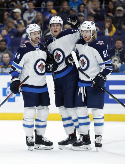 Winnipeg Jets’ Patrik Laine, of Finland, is congratulated by Josh Morrissey (44) and Kyle Connor (81) after scoring during the first period of an NHL hockey game against the St. Louis Blues, Saturday, Nov. 24, 2018, in St. Louis. (Jeff Roberson / Associated Press)