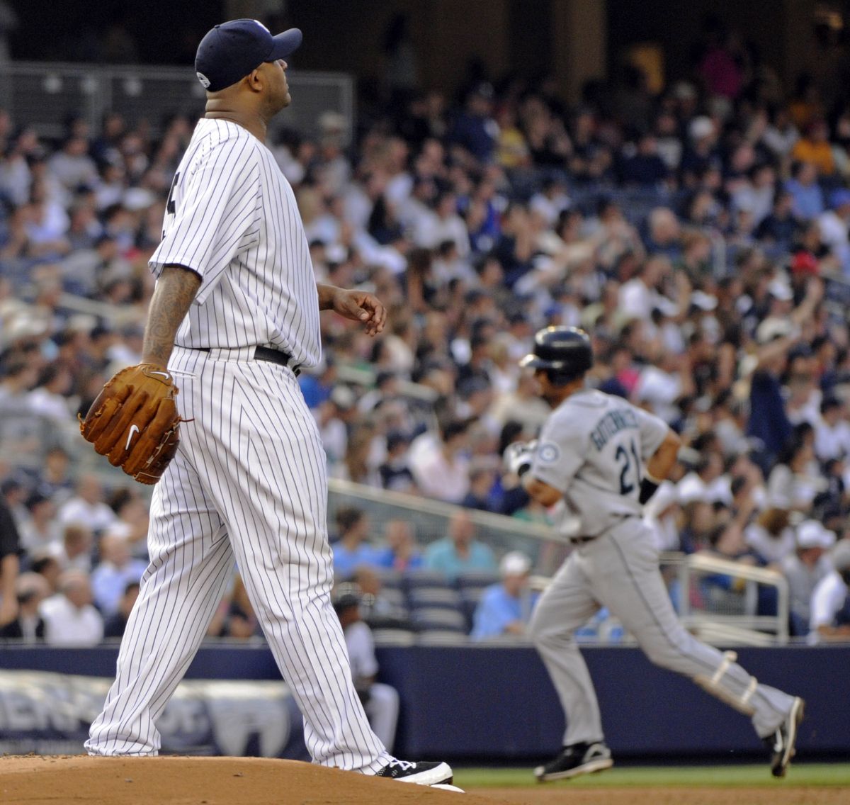 Associated Press Seattle’s Franklin Gutierrez, right, rounds the bases after hitting a home run off Yankees starting pitcher CC Sabathia. (Associated Press / The Spokesman-Review)