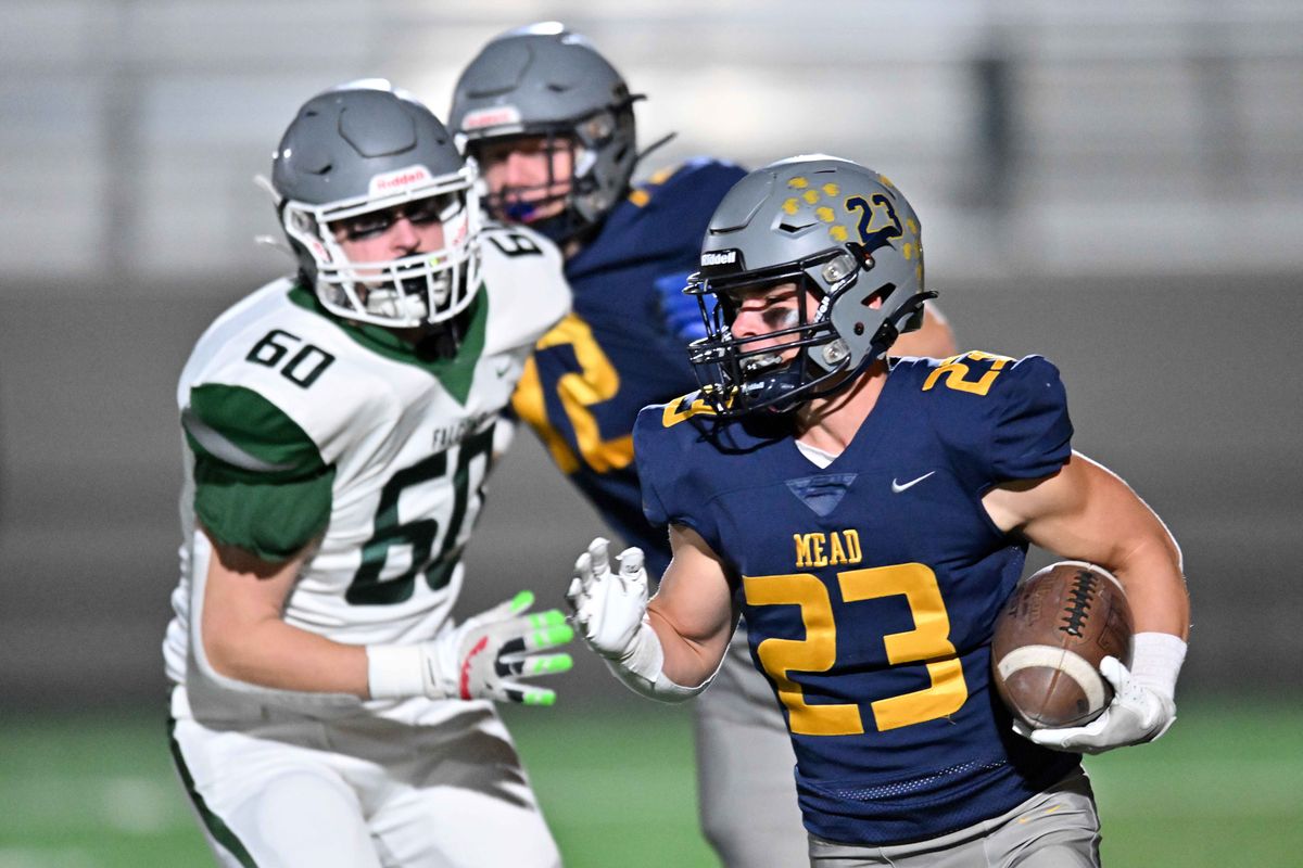 Mead Panthers James Frahm (23) get by Ridgeline Falcons Preston Wentling (60) during the first half at Union Stadium on Fri. Oct. 10, 2024 in Spokane WA.  (James Snook/For The Spokesman-Review)