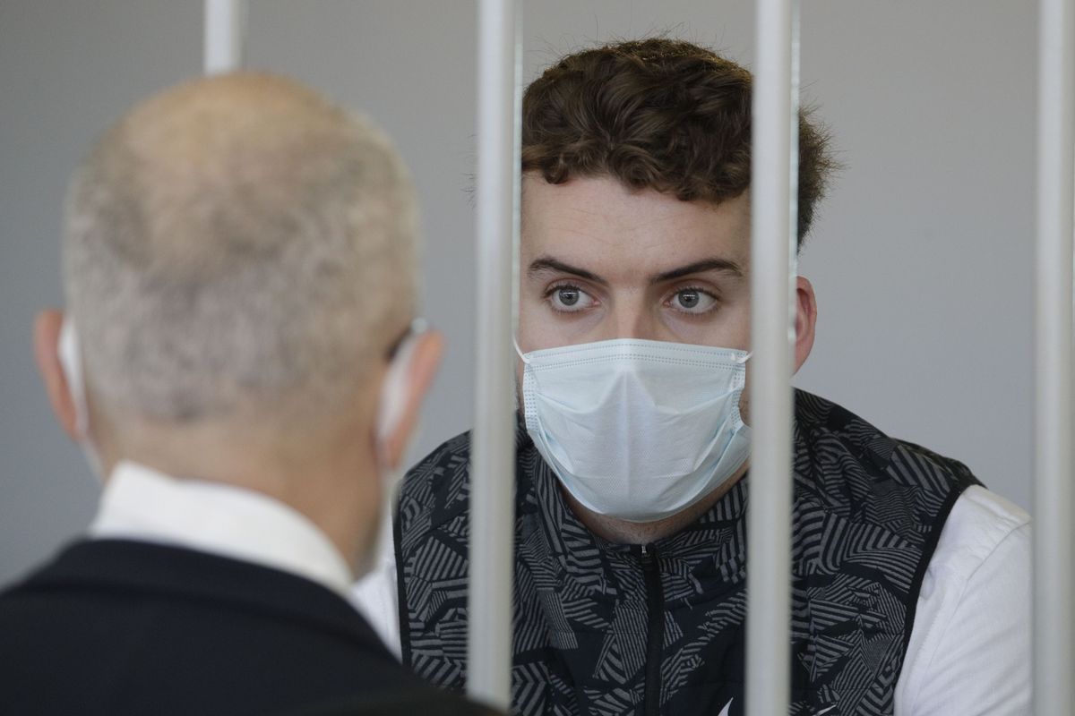 Gabriel Natale-Hjorth wears a face mask to curb the spread of COVID-19 as he sits inside a cell in the courtroom before a jury began deliberating his fate and that of his co-defendant Finnegan Lee Elder in their trial accused of the slaying of an Italian plainclothes police officer on a street near the hotel where they were staying while on vacation in Rome in summer 2019, in Rome on May 5, 2021. Lawyers and family of two young American men convicted of murdering a police officer in Rome said they are hoping for a better outcome in the defendants
