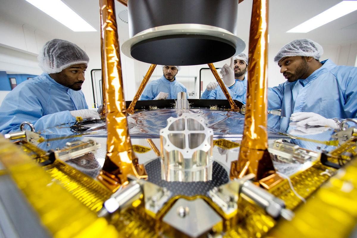 In this undated photo provided by the United Arab Emirates Space Agency, engineers discuss further steps to disassemble a spacecraft’s sun shield baffle for further inspections. As Mars’ newest resident settles in, Planet Earth is working on three more landers and at least two orbiters to join the scientific Martian brigade. The United Arab Emirates aims to send its first spacecraft to Mars in 2020; the orbiter is named Hope, or Amal in Arabic. NASA’s InSight spacecraft touched down on Mars on Monday, Nov. 26, 2018. (AP)