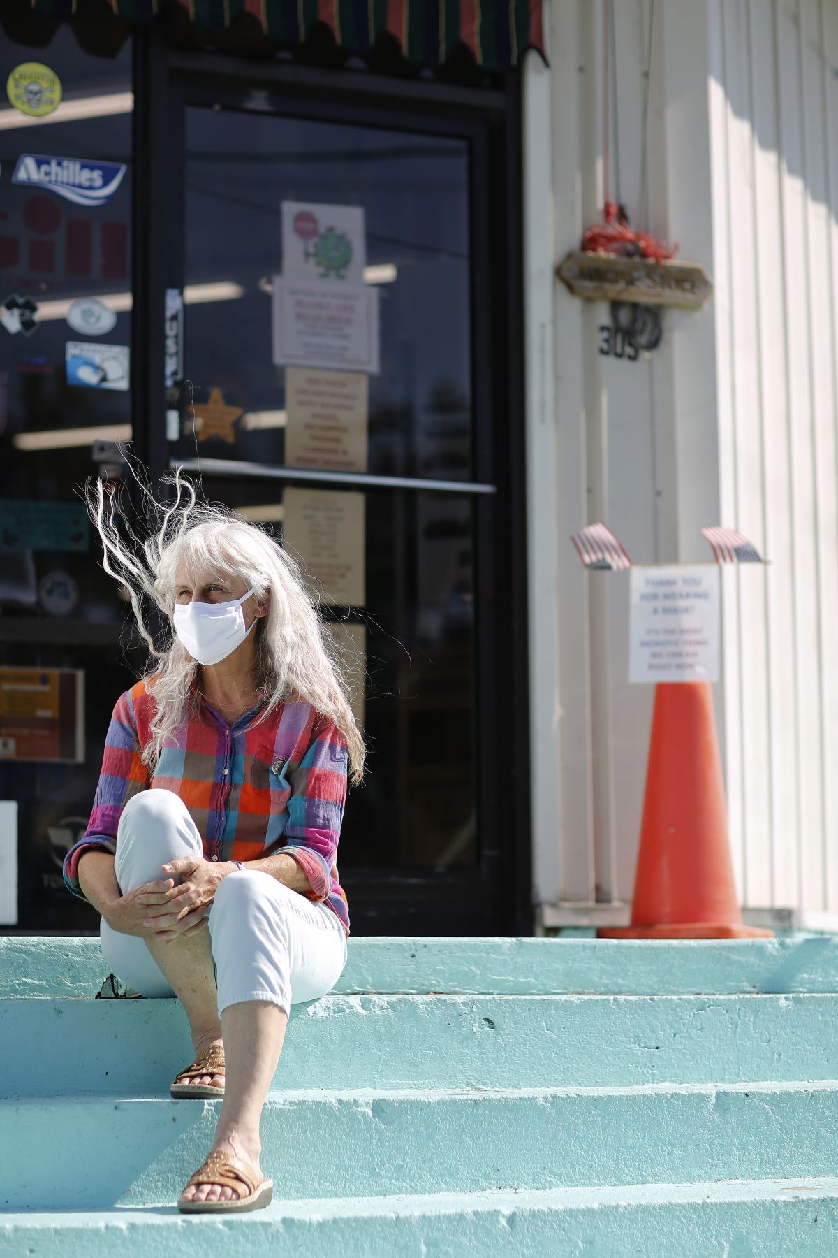 Retail clerk Lori Wagoner discusses trying to enforce a state requirement to wear masks.  (Eamon Queeney for the Washington Post)