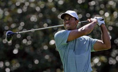 
Tiger Woods tees off during the third round of The Tour Championship. Associated Press
 (Associated Press / The Spokesman-Review)